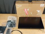 a laptop computer sitting on a table next to a box
