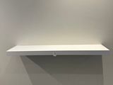 a picture of a white shelf in a room