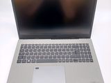 an open laptop computer sitting on top of a white table