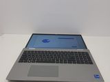 a laptop that is sitting on a white table