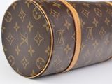 a close up of a louis vuitton bag on a white surface