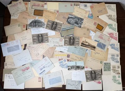 many old postcards and envelopes on a table