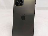a close up of a black iphone sitting on top of a table
