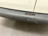 a close up of a car bumper with a sticker on it