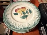 many plates that are sitting on a table