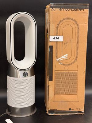 an image of a box with a white air purifier next to it