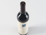 a bottle of wine that is sitting on a table