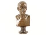 bronze bust of a man on a pedestal on a white background