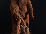 statue of a man holding a woman on his back