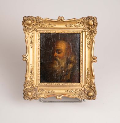 painting of a bearded man in a gold frame on a white background