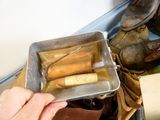 a person that is holding a tray with some tools in it