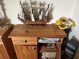 a small table with a boat on top of it