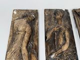 three pieces of art that are on a table