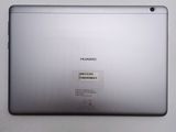 a close up of the back of a silver tablet with a sticker on it