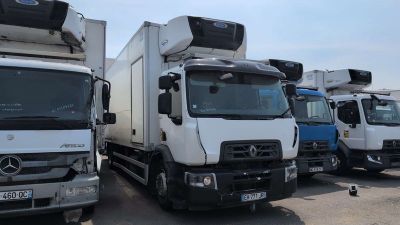many trucks that are parked in a parking lot