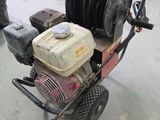 a small engine on a cart in a garage
