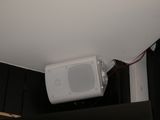 a microwave sitting on top of a cabinet in a room