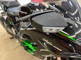 a close up of a motorcycle parked in a garage
