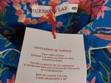 an image of a blue floral shirt with a tag on it