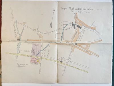 an old map of a city on a piece of paper on a table