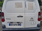 a white van that is parked in a parking lot