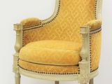an image of a yellow chair in a room with a white wall
