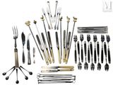 many different types of silverware and forks and spoons