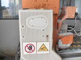 a machine that is working on a piece of machinery