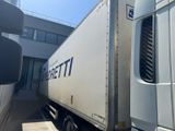 a white truck that is parked in front of a building