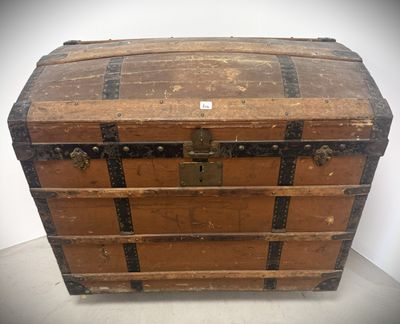 an old trunk sitting on a table in a room
