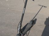 a scooter that is sitting in the parking lot