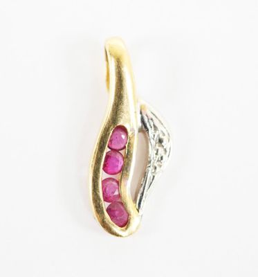 a close up of a gold and pink stone pendant on a white background