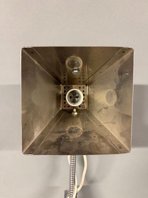 a metal box that has a light on top of it