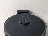 an image of a robotic vacuum cleaner sitting on top of a counter