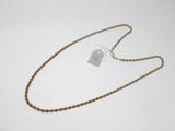 a close up of a gold chain with a tag on it