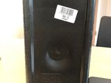 a black speaker that is sitting on a table