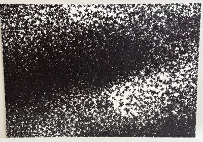 an abstract black and white painting on a white wall