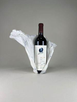 a bottle of wine wrapped in a plastic bag