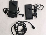 two batteries and a charger sitting on a table