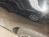 a close up of a car ' s door with a reflection on it