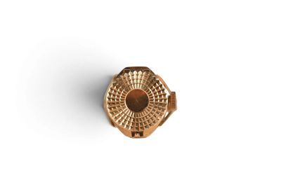 a close up of a gold ring on a white surface