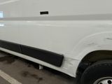 a white van that is parked in a parking lot