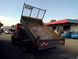 a dump truck that is sitting in the parking lot
