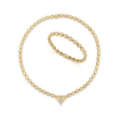 un ensemble composé d'un collier et d'un bracelet en or sertis d'un diamant