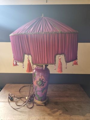 a lamp that is sitting on a table in a room