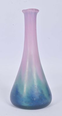 a blue and pink vase sitting on a white surface