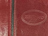 leather wallet with a logo on the inside of it