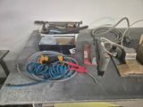 a table with a bunch of tools on it