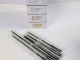 four straws in a package on a white table
