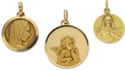 three gold - plated pendants depicting the virgin and child